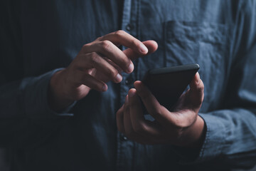 man hand holding and using smartphone, tablet, cell phone touching on screen. mobile phone application technology. copy space for text.