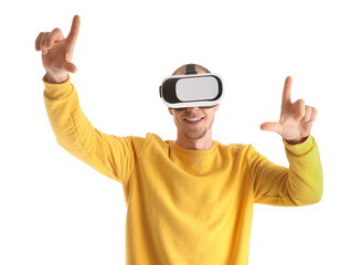 Fototapeta premium Young man using VR glasses on white background