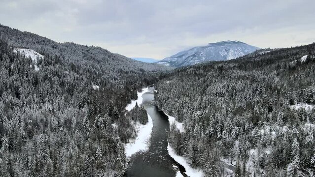 Majestic Mountains and Winter Wonderland: A Drone's Eye View of the Adams River in British Columbia