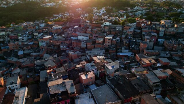 Aerial view over slum houses in the Nova Jaguare favela sunset in Sao Paulo, Brazil