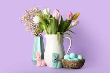 Vases with beautiful flowers, Easter eggs and bunnies on color background