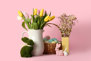 Vases with beautiful flowers, Easter eggs and bunnies on pink background