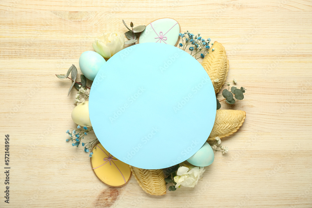 Wall mural blank card with flowers, eggs and treats on light wooden background. novruz bayram celebration