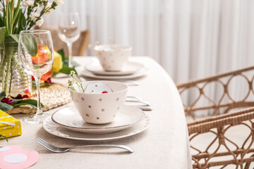Table setting for International Women's Day celebration with daisy flowers in dining room