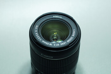 Close up of camera lens on gray background
