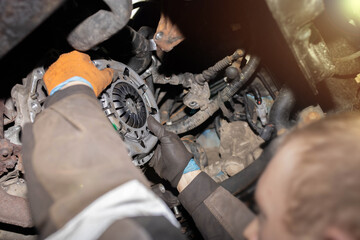 installing a new clutch kit on the car gearbox.