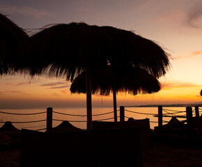 Sun lounger on the beach at sunset.
