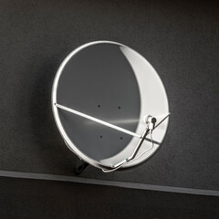 Satellite dish on the wall of a private house.