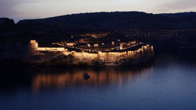 Aerial view of Rumkale fortress on a peninsula on the Euphrates. Illuminated view of an ancient fortress at night  . 4K