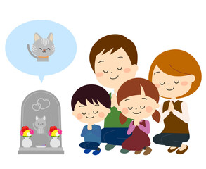 ペットのお墓参りをする家族（秋冬）