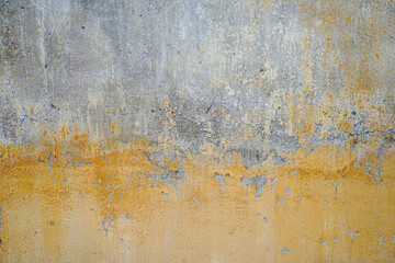 Old and vintage yellow cement wall background