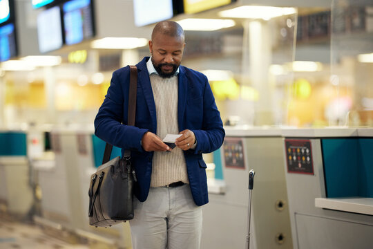 Black Man, Airport And Passport With Plane Ticket Ready For Travel, Departure Or Flight Time By Help Desk. African American Male Waiting At Airline Terminal With Documents For Traveling Services