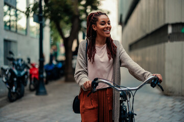 Portrait of cheerful woman with bicycle.