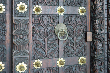 Zanzibar's ornate wooden doors in Stone Town showcase its rich history and culture. Their unique designs are a must-see for any visitor