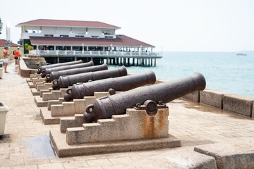 Cannons in Stone Town, Zanzibar, are a reminder of its dark history of slavery. These relics serve...