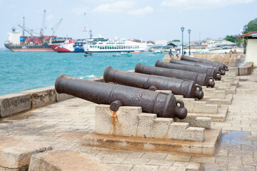 Fototapeta na wymiar Cannons in Stone Town, Zanzibar, are a reminder of its dark history of slavery. These relics serve as a somber reminder of the island's past.