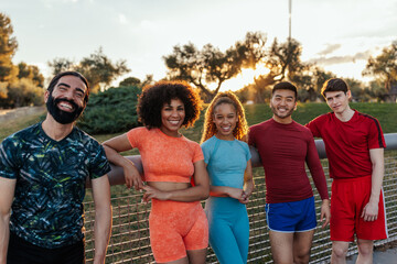Smiling team of athletes outdoors