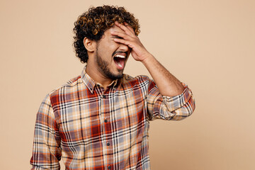 Sad upset Indian man wear brown shirt casual clothes put hand on face facepalm epic fail mistaken...