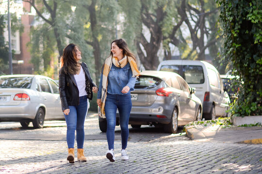 Women crossing road in city