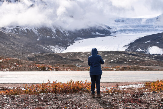 Woman watching Athabasca glacier, Jasper National Park