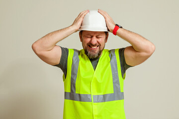 worker in a vest and white helmet