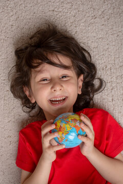 Happy preschooler boy discovering world as back to school concep