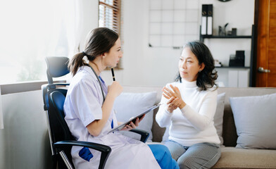Obraz premium Psychology, depression. Suffering asian old woman, consulting with psychologist, psychiatrist while patient counseling mental problem. Encouraging, health care..