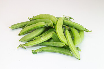 Fresh green peas isolated on white background. Pea pods on white background.