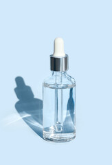 serum on a blue background with natural light