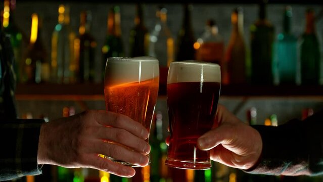 Super Slow Motion Shot of Clinking Two Pints of Beer. Filmed on high speed cinematic camera at 1000fps