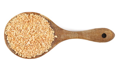 Chopped dry garlic pile in wooden spoon, isolated on white, top view