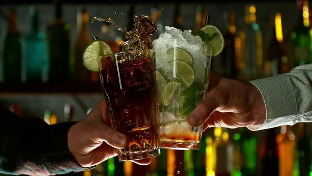 Super Slow Motion Shot of Clinking Two Cocktail Glasses. Filmed on high speed cinematic camera at 1000fps