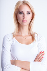 portrait of attractive blond woman on white background