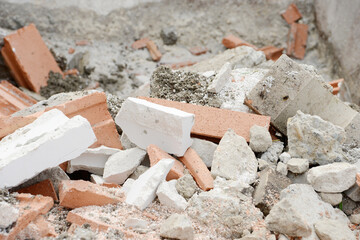 Building rubble, destroyed bricks in the rubble container when building a house - 572187172