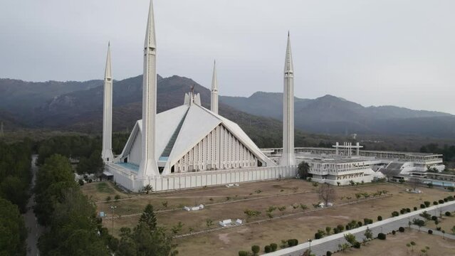Still aerial shot of Faisal mosque Islamabad. A drone shot of Faisal mosque Islamabad with Margala hills view in the background.