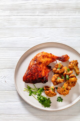 baked chicken leg with spicy roast cauliflower