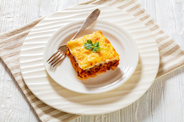 Greek Pastitsio on white plate, top view