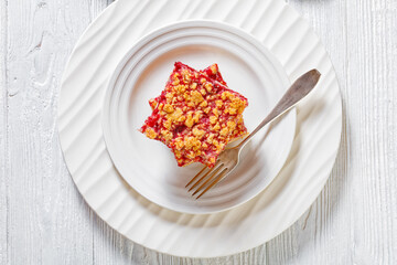 Raspberry Crumble Bars on white plate, top view