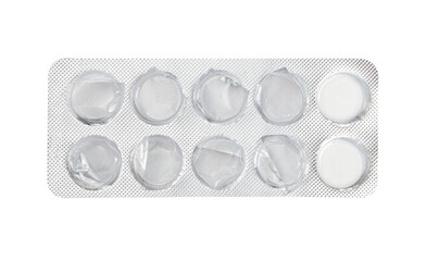 Empty silver blister with two medical pills left, isolated on white background. Used tablets,...