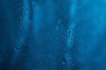 Drops of rain water droplets on glass