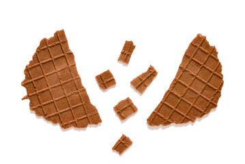 Wafers are round, broken in half, isolated. Thin waffle cookies, chocolate Belgian waffles, waffle breakfast on a white background	