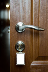 open door with lock, hotel room or apartment doorway with open door