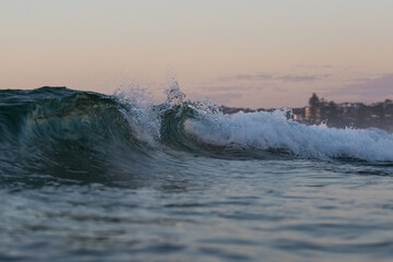 Wave barrel breaking on the shore.