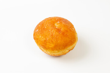 A Berliner type donut with icing and sugar on a white background