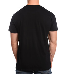 Man wearing black t-shirt on white background, back view. Mockup for design