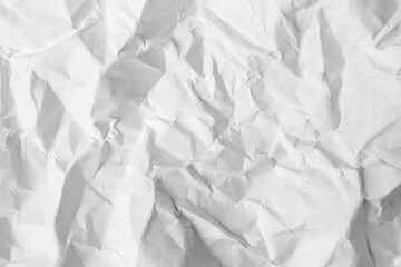 Obraz premium Sheet of crumpled paper white as background, top view
