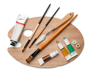 Wooden palette with oil paints and tools on white background, top view