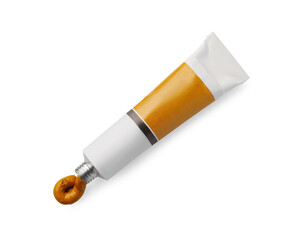 Tube with oil paint on white background, top view