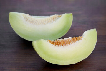 Cut tasty ripe melon on wooden table