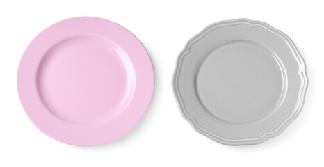 Different ceramic plates on white background, top view